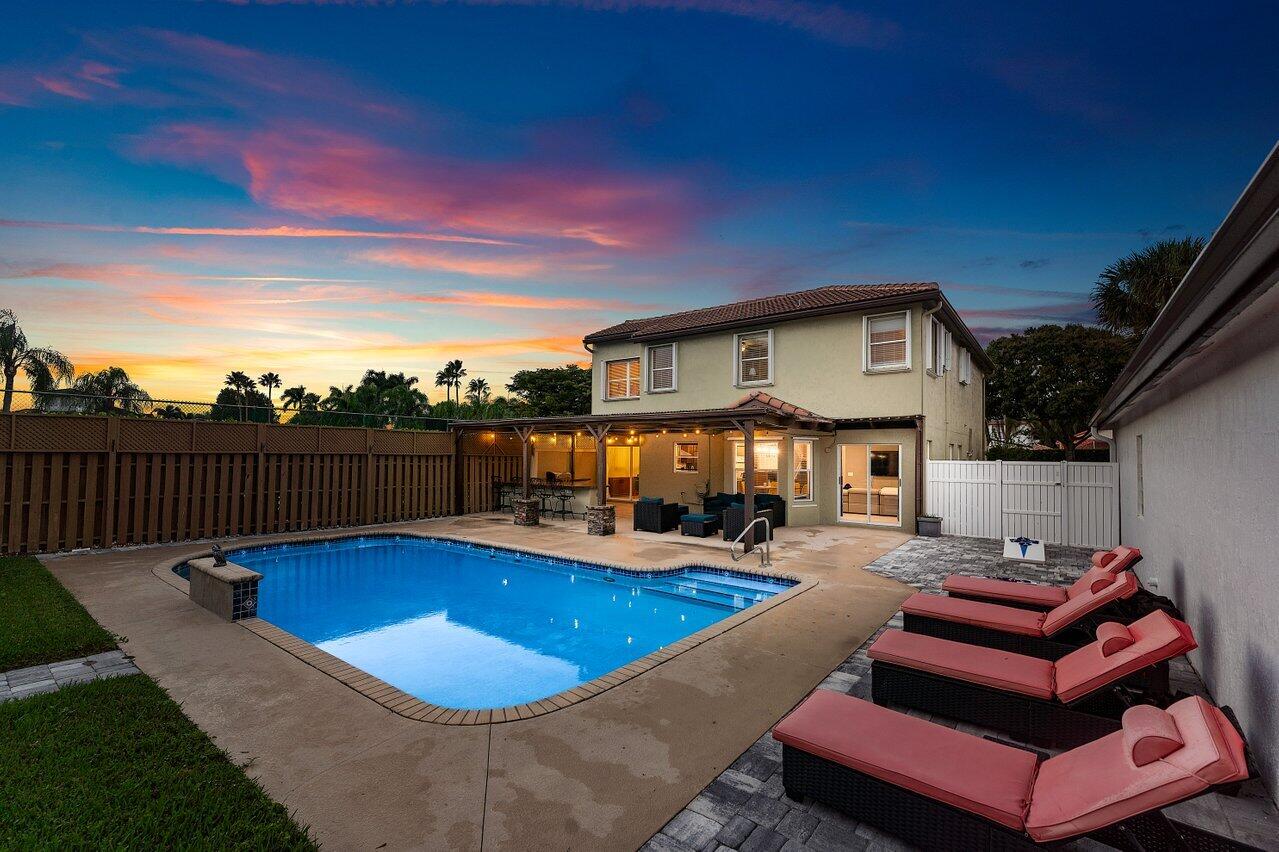 9434 Fox Trot Lane Boca Raton, FL 33496 - Photo 49 of 66 a view of a swimming pool with seating space