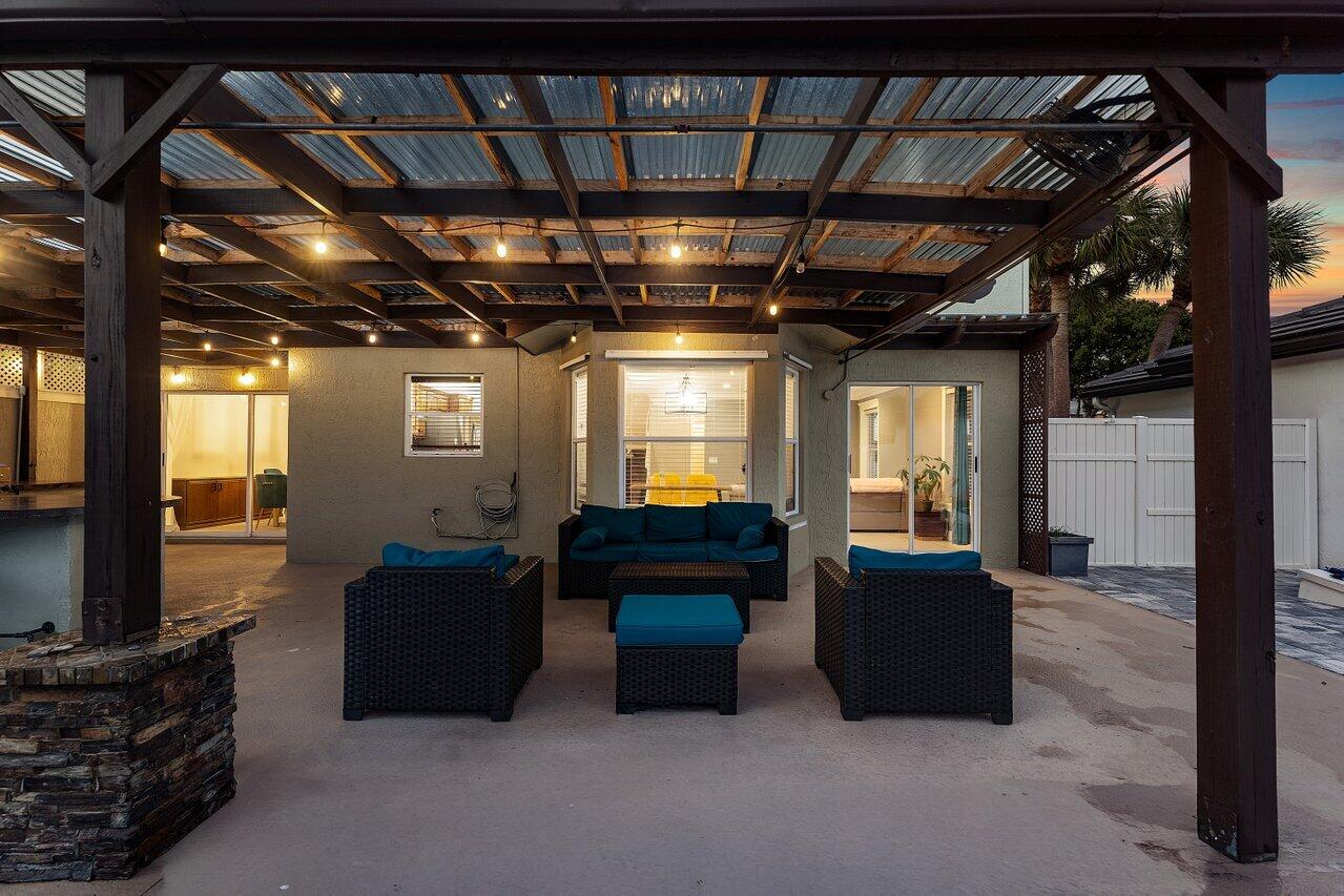 9434 Fox Trot Lane Boca Raton, FL 33496 - Photo 53 of 66 a living room with furniture and a flat screen tv
