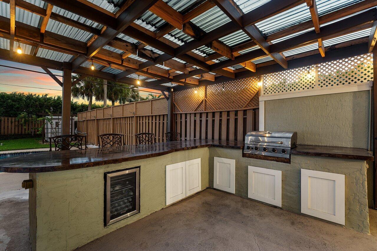 9434 Fox Trot Lane Boca Raton, FL 33496 - Photo 55 of 66 a kitchen with a sink and cabinets