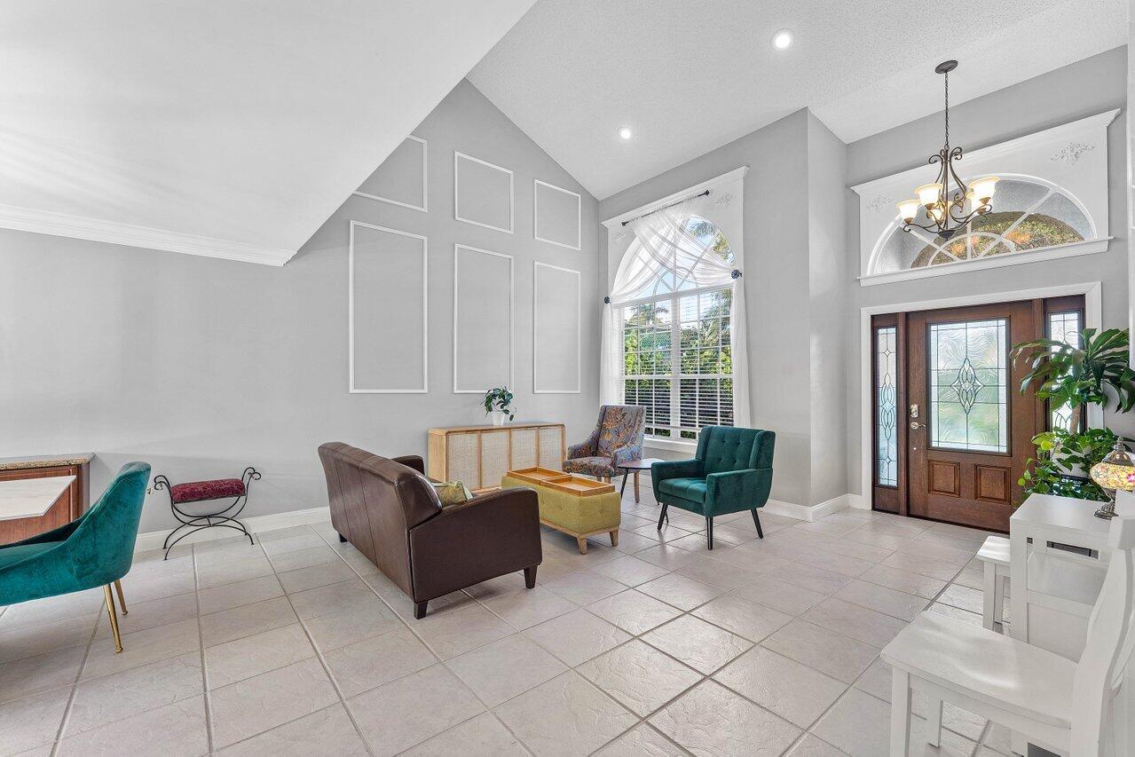 9434 Fox Trot Lane Boca Raton, FL 33496 - Photo 8 of 66 a living room with furniture and a large window