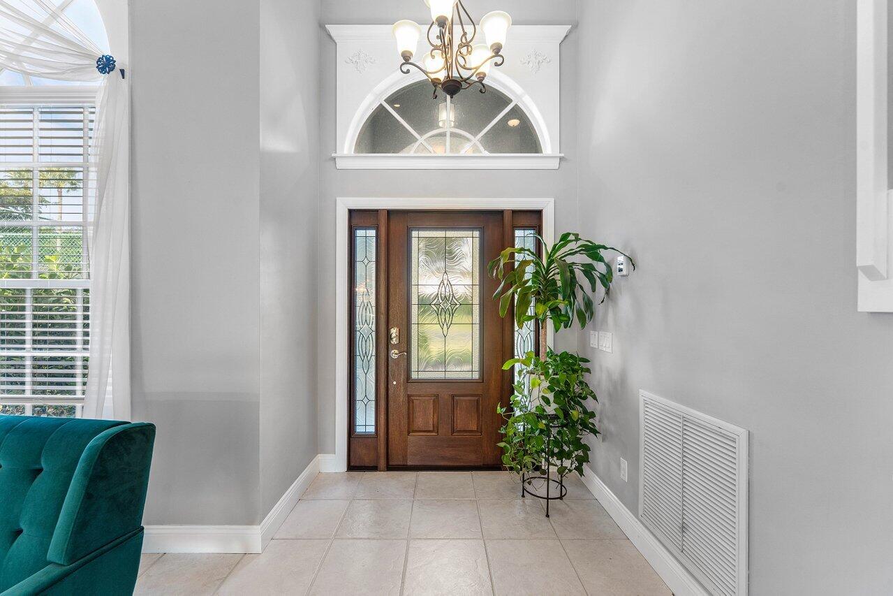9434 Fox Trot Lane Boca Raton, FL 33496 - Photo 9 of 66 a view of entryway with a potted plant