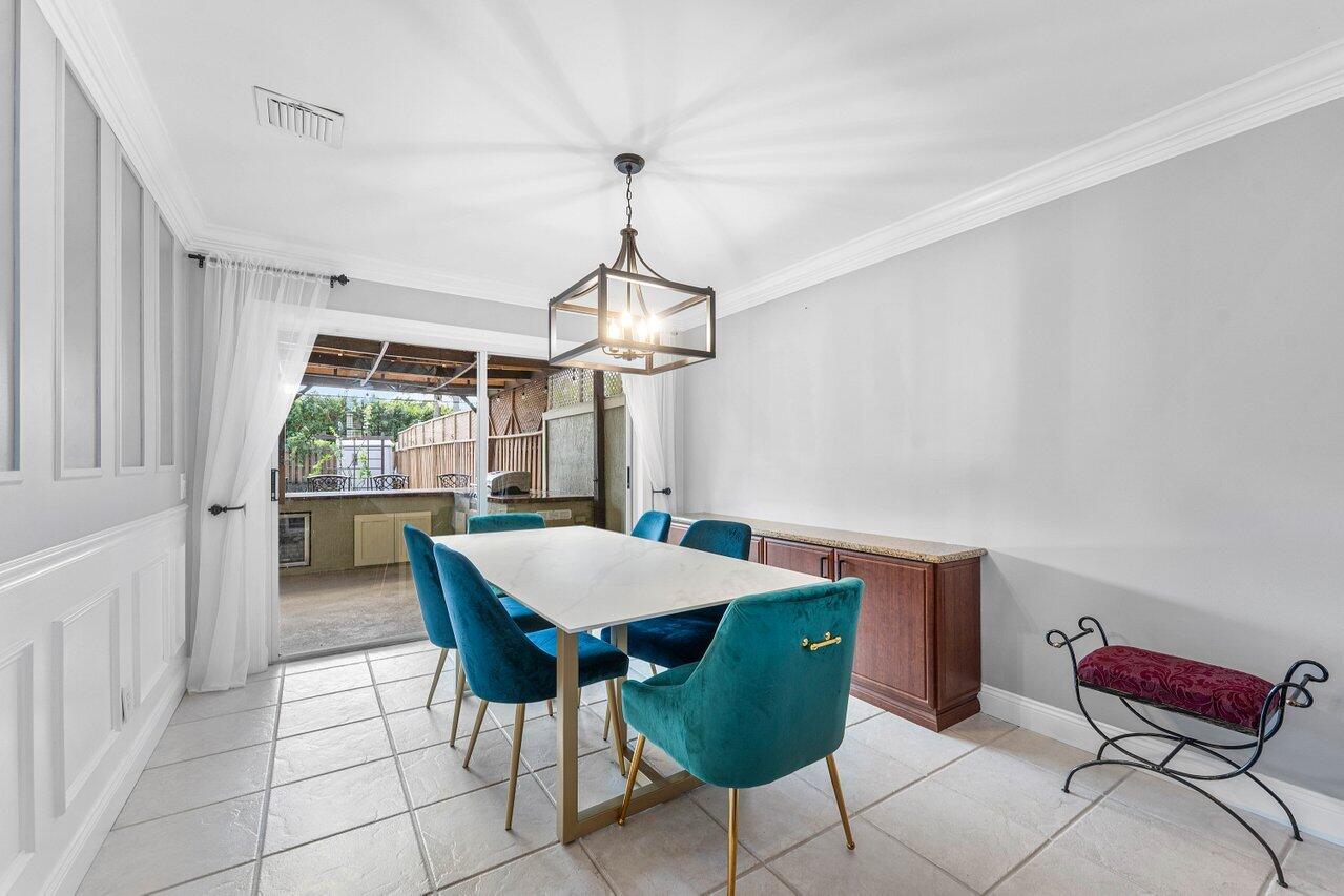 9434 Fox Trot Lane Boca Raton, FL 33496 - Photo 10 of 66 a view of a dining room with furniture window and outside view