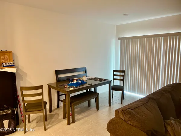 a reading room with furniture and a window