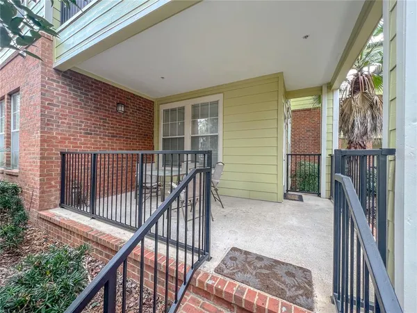 a view of a balcony with iron fence