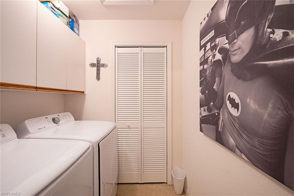 841 Tanbark Drive, Unit 202 Naples, FL 34108 - Photo 9 of 12 a utility room with dryer and washer