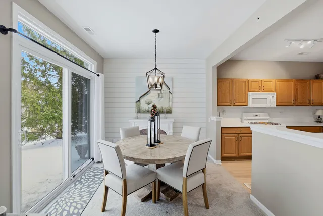 a dining room with furniture and window