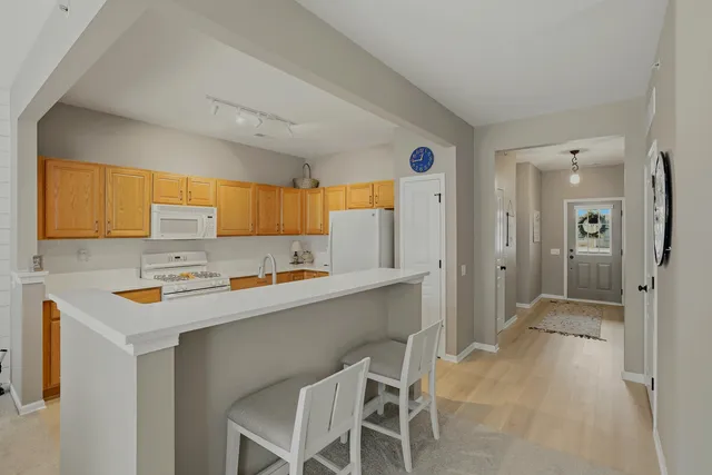 a kitchen with a sink cabinets and window