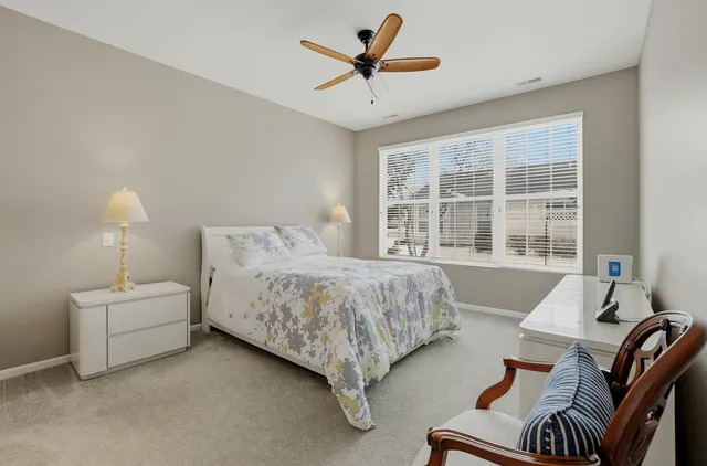 a bed room with a bed and a window