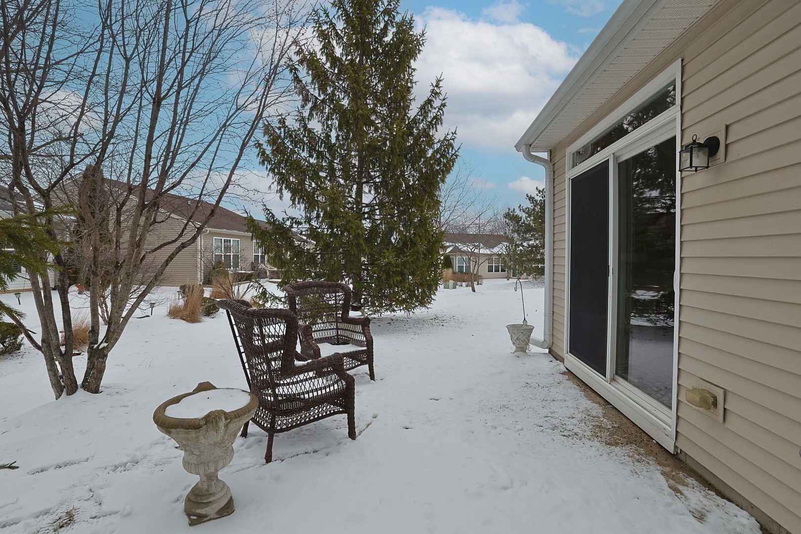13306 Arboretum Lane Huntley, IL 60142 - Photo 3 of 19 a backyard of a house with table and chairs
