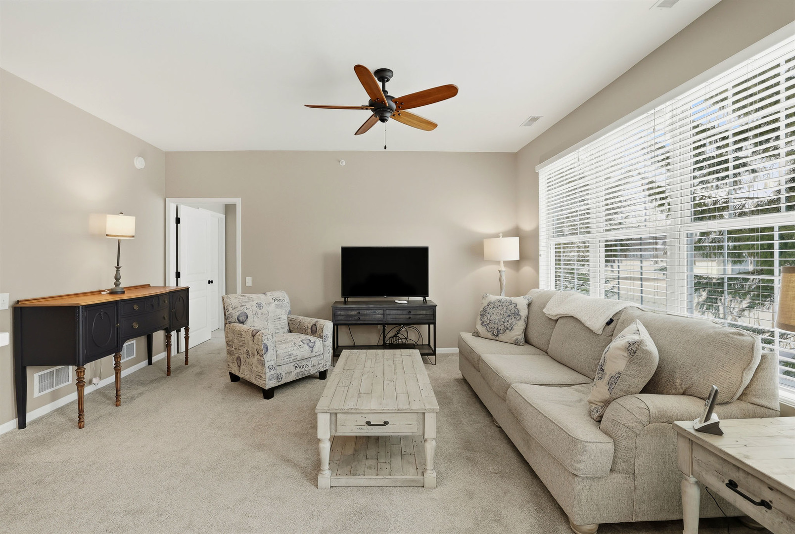 13306 Arboretum Lane Huntley, IL 60142 - Photo 6 of 19 a living room with furniture and a flat screen tv
