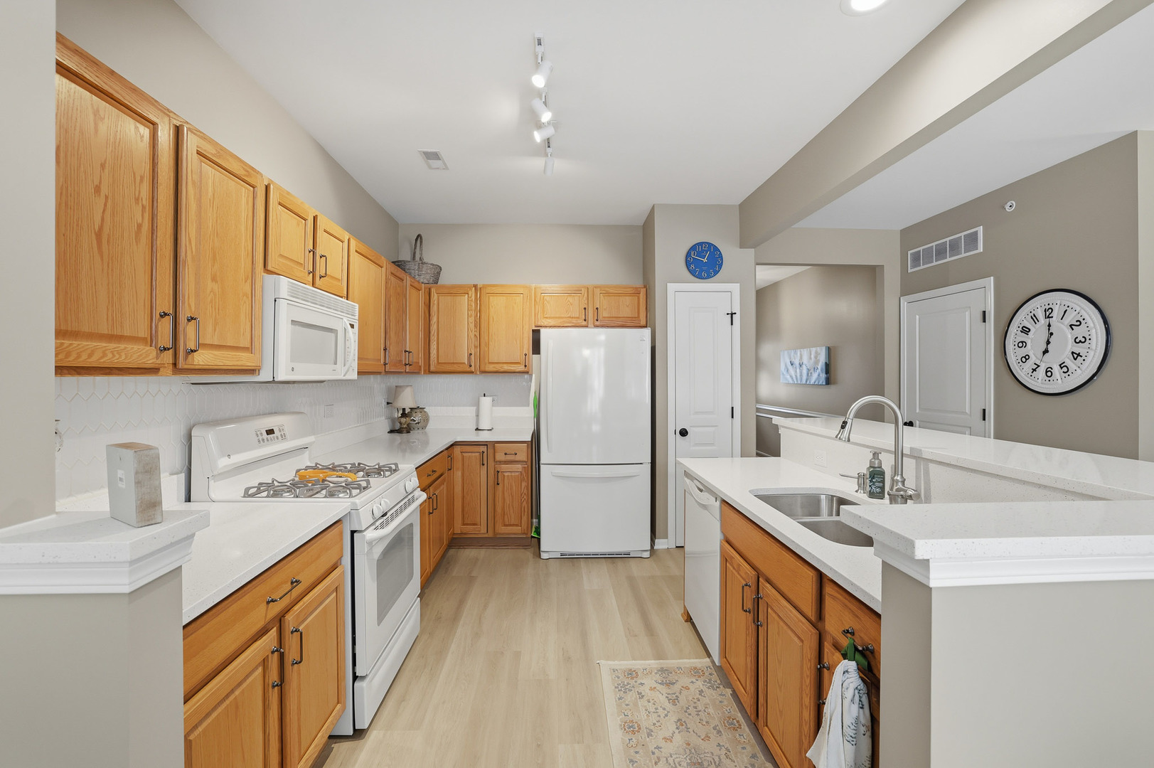 13306 Arboretum Lane Huntley, IL 60142 - Photo 8 of 19 a kitchen with a sink stove and refrigerator