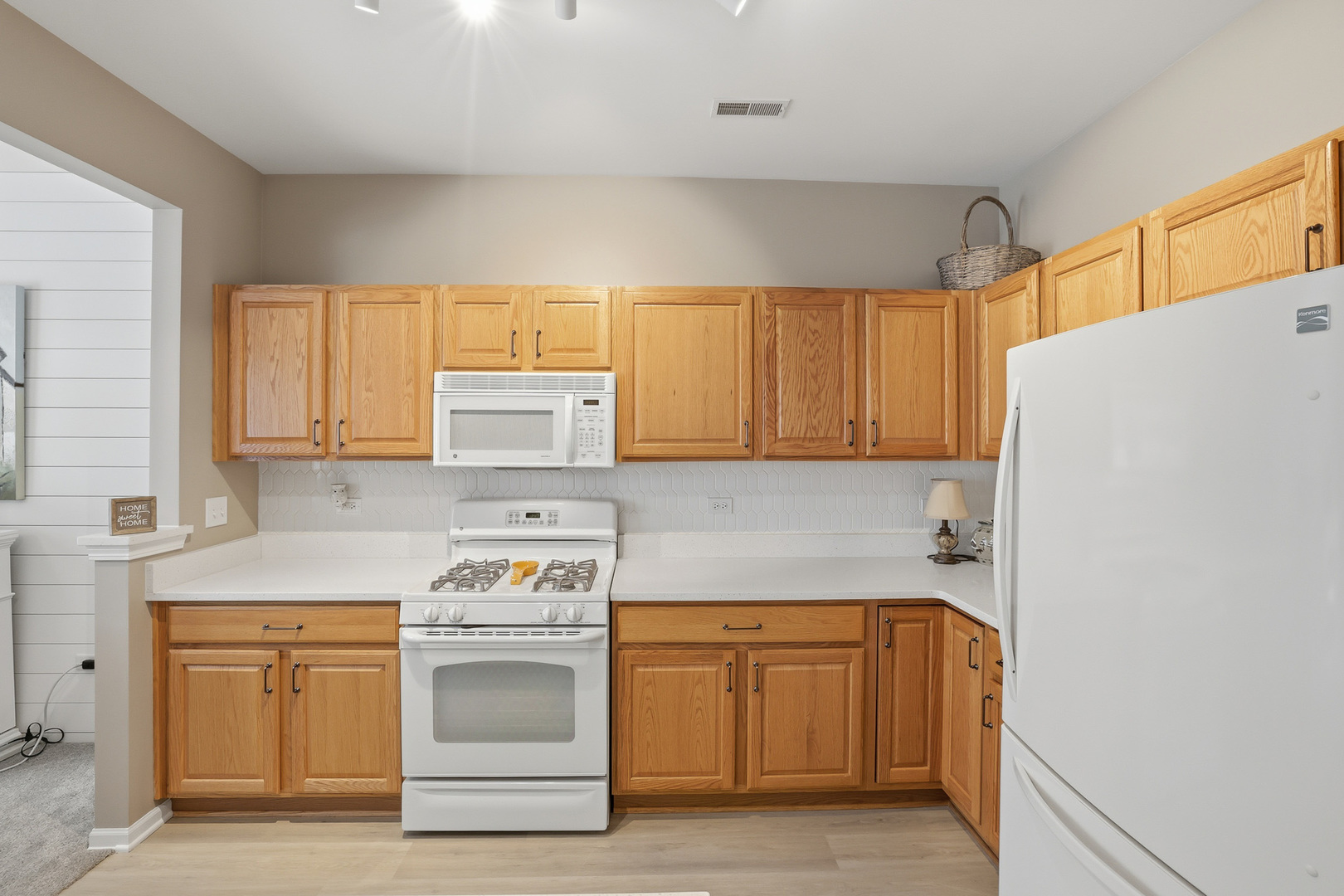 13306 Arboretum Lane Huntley, IL 60142 - Photo 9 of 19 a kitchen with a refrigerator stove and sink