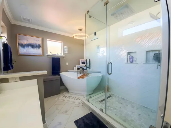 a living room with furniture and a painting on the wall