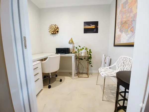 a workspace with furniture and window