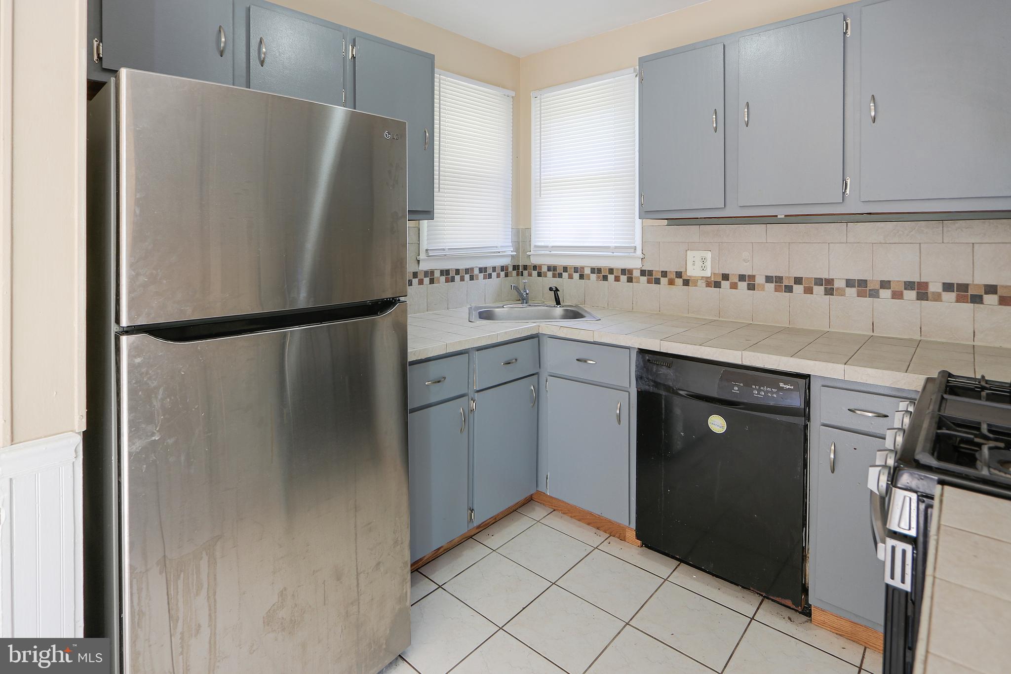 301 Pond View Lane Bear, DE 19701 - Photo 5 of 11 a white refrigerator freezer sitting inside of a kitchen