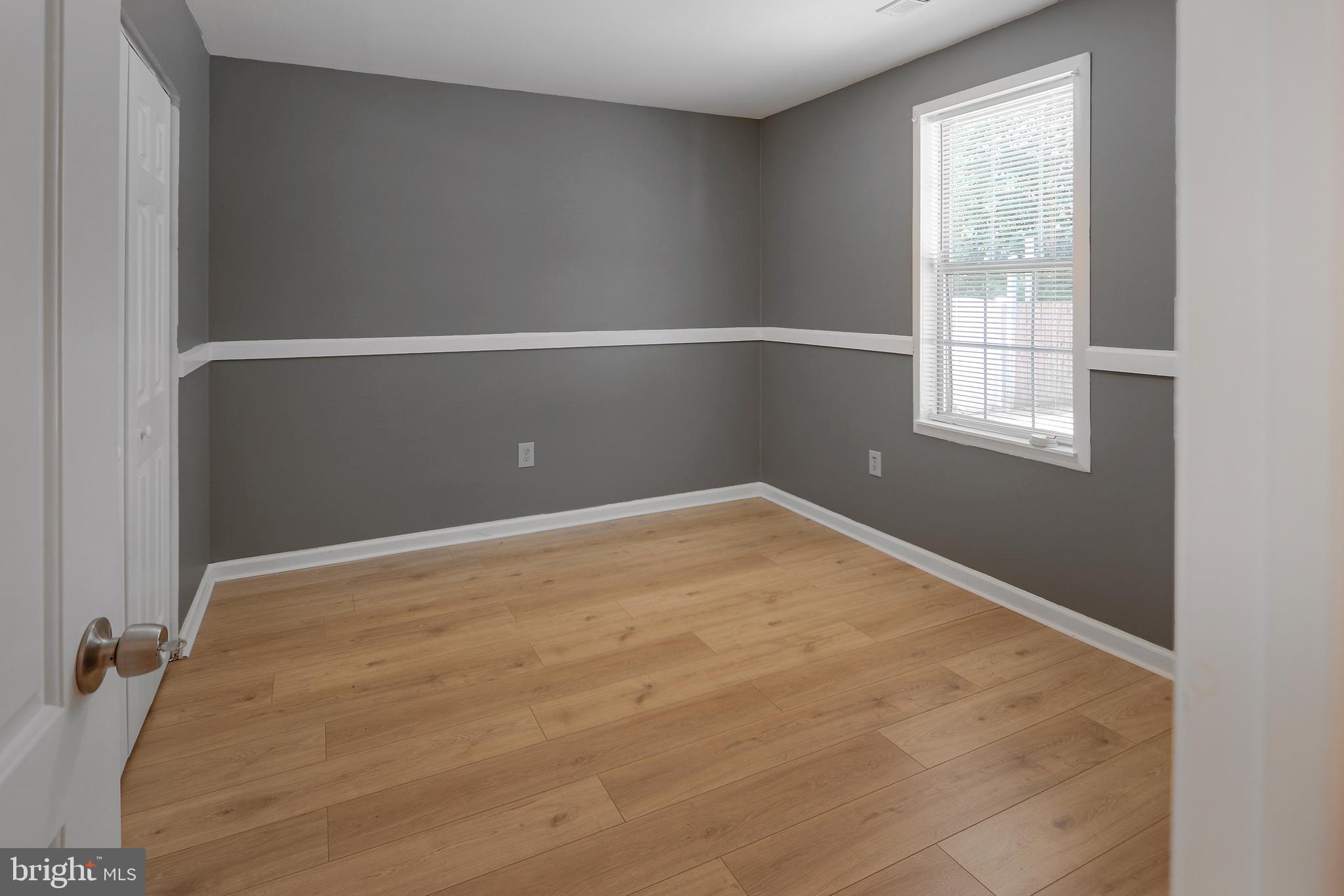 301 Pond View Lane Bear, DE 19701 - Photo 10 of 11 a view of empty room with windows