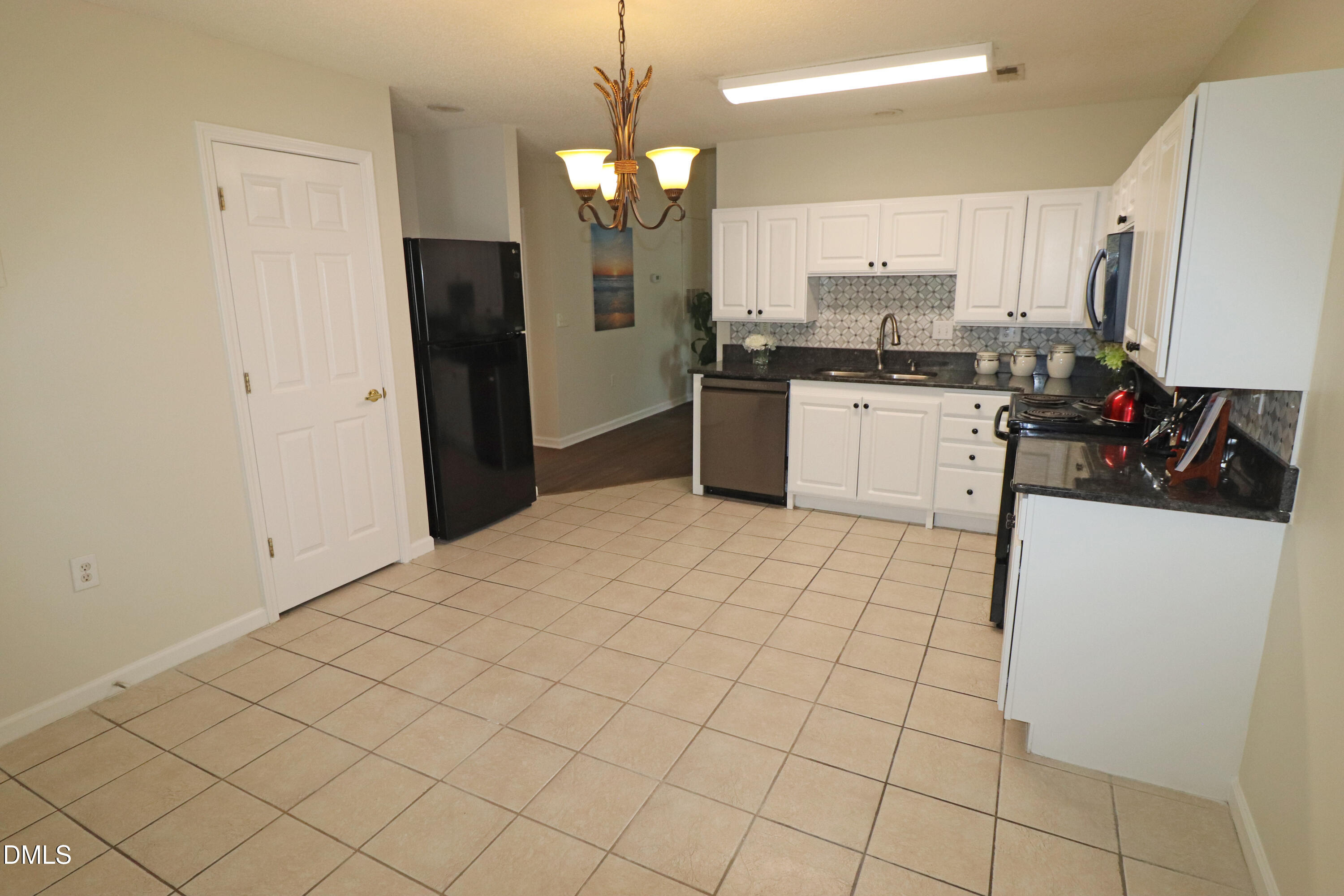 11351 Involute Place, Unit 103 Raleigh, NC 27617 - Photo 12 of 45 Tile floor in kitchen