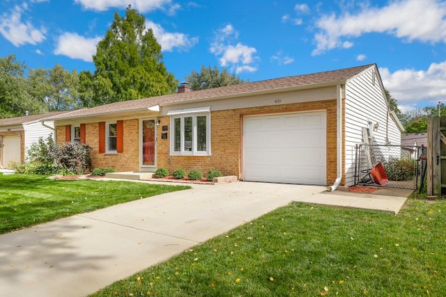 439 Glendale Road Buffalo Grove, IL 60089 - Photo 2 of 22 a front view of a house with a yard and garage