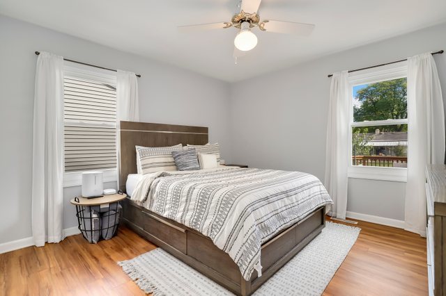 439 Glendale Road Buffalo Grove, IL 60089 - Photo 10 of 22 a large bed sitting in a bedroom next to a window