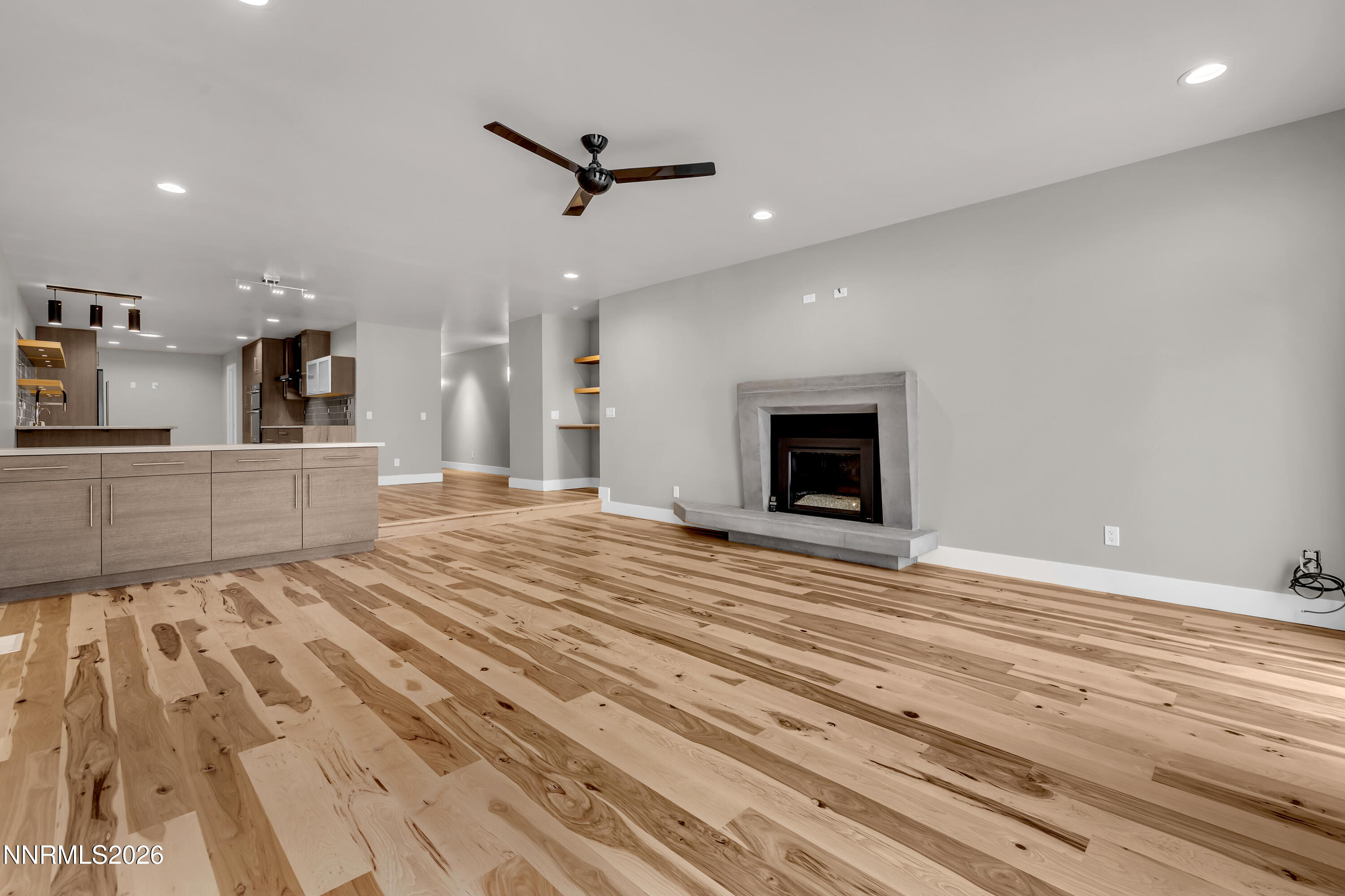 4957 Lakeridge Terrace West Reno, NV 89509 - Photo 12 of 44 a view of a livingroom with a furniture a ceiling fan and wooden floor