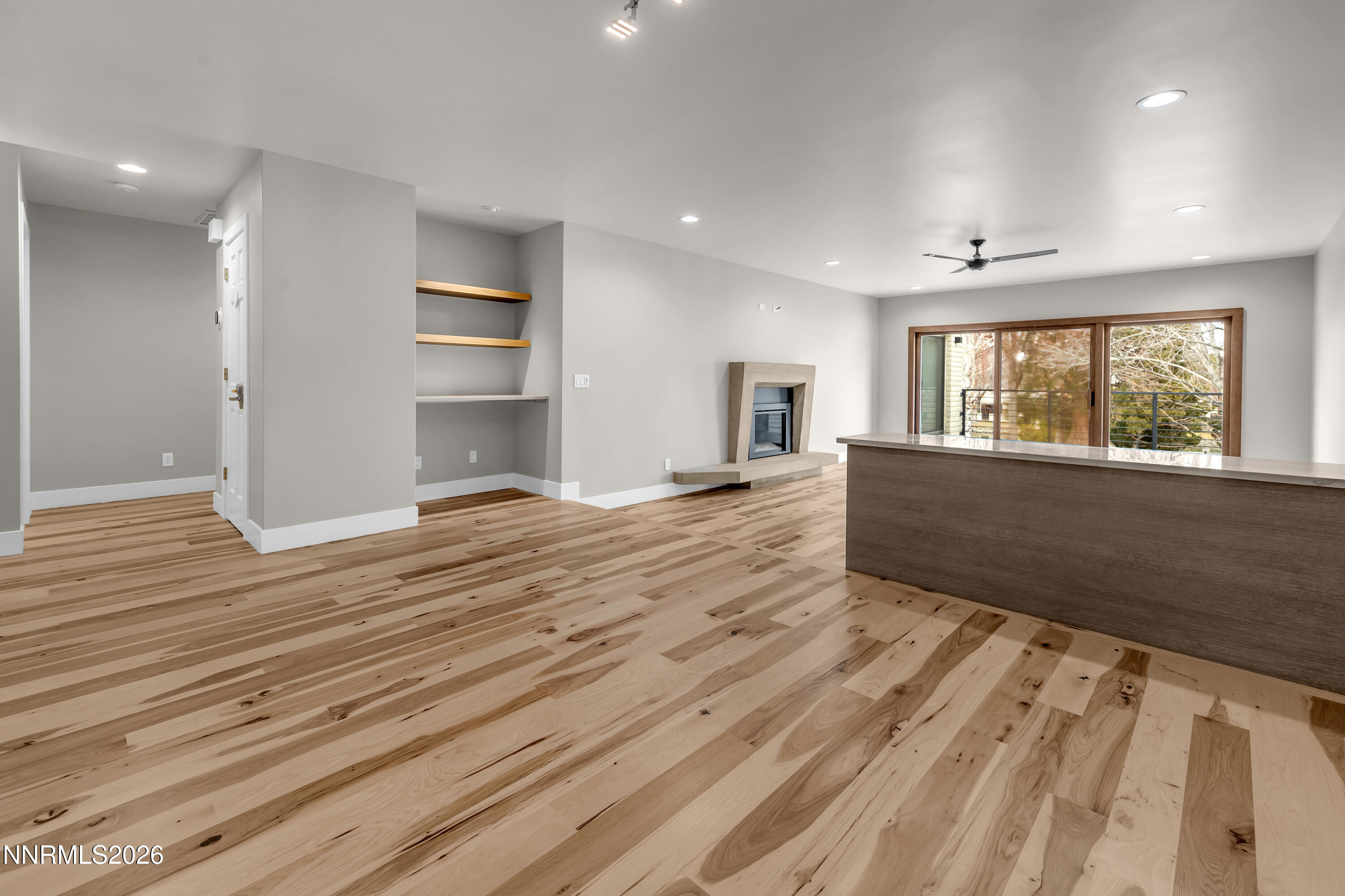 4957 Lakeridge Terrace West Reno, NV 89509 - Photo 16 of 44 an empty room with wooden floor and windows
