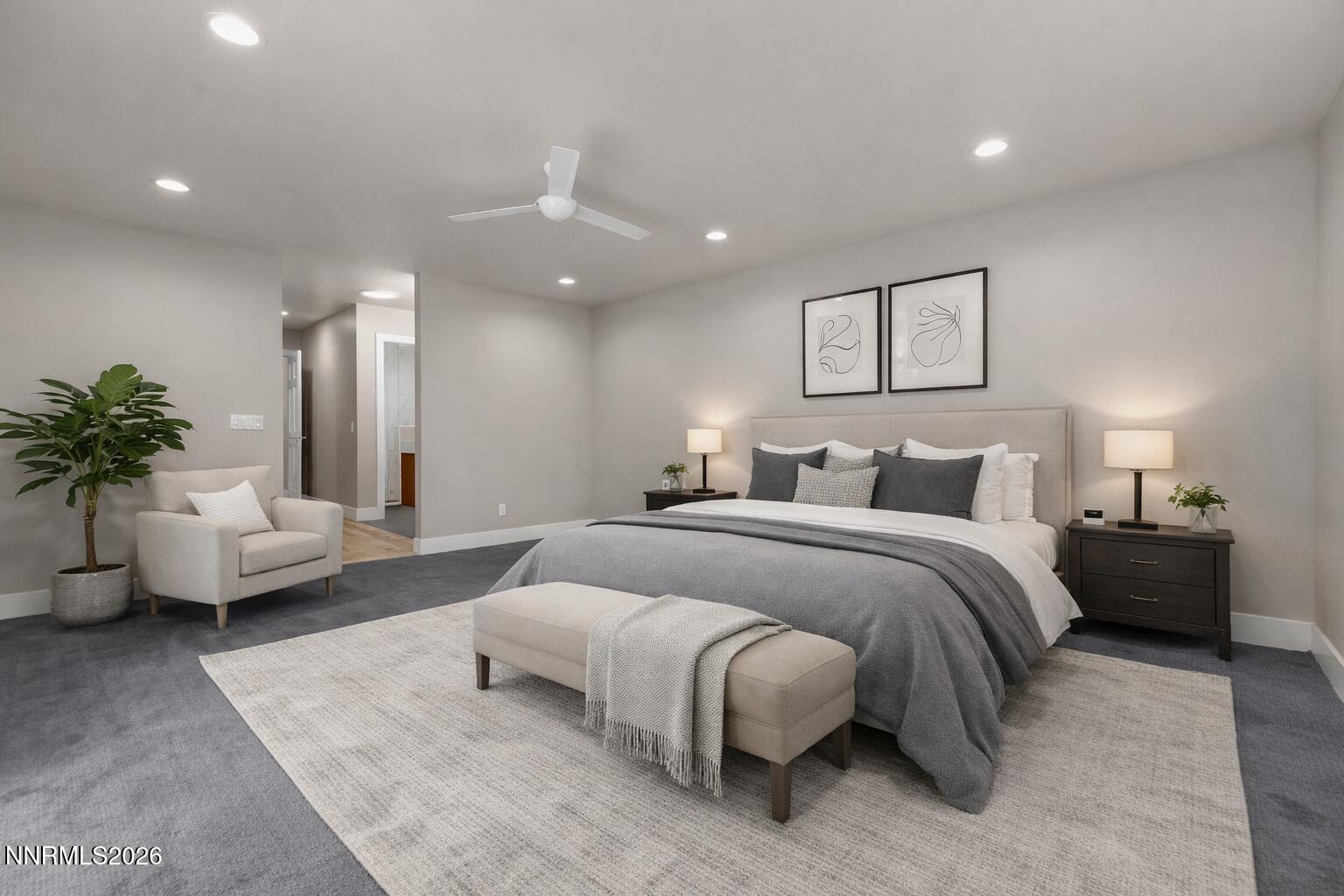 4957 Lakeridge Terrace West Reno, NV 89509 - Photo 17 of 44 a spacious bedroom with a bed and couch