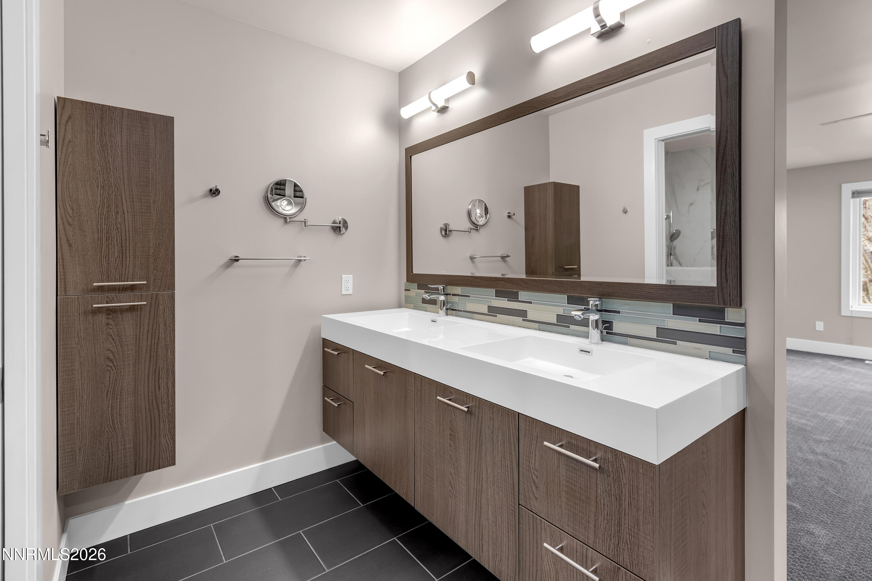 4957 Lakeridge Terrace West Reno, NV 89509 - Photo 21 of 44 a bathroom with a sink vanity and a mirror
