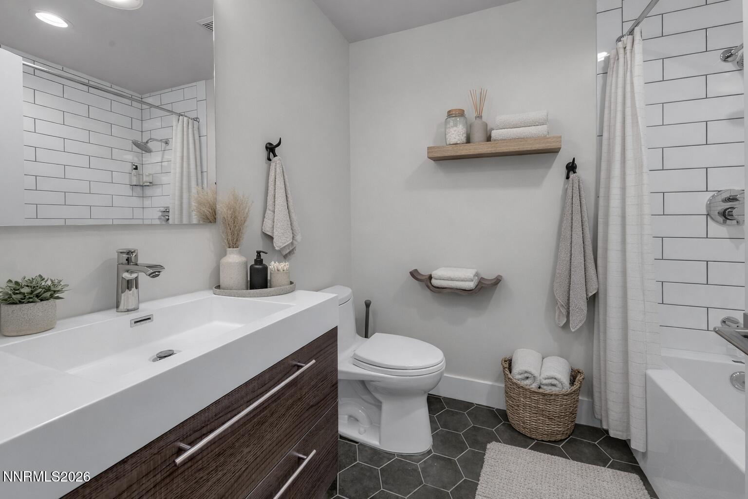 4957 Lakeridge Terrace West Reno, NV 89509 - Photo 28 of 44 a bathroom with a sink toilet and tub