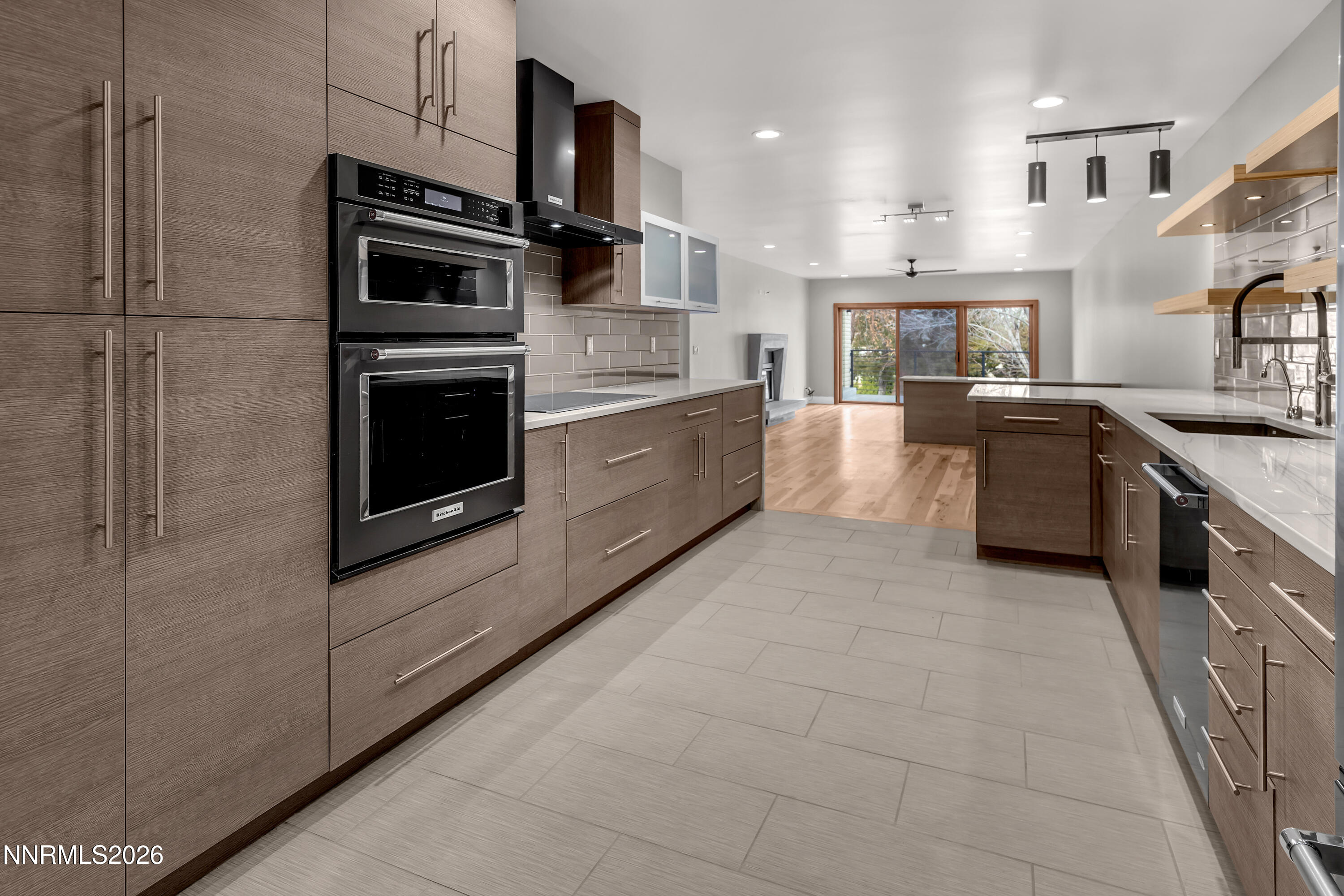 4957 Lakeridge Terrace West Reno, NV 89509 - Photo 7 of 44 a large kitchen with stainless steel appliances granite countertop a stove a sink and a refrigerator
