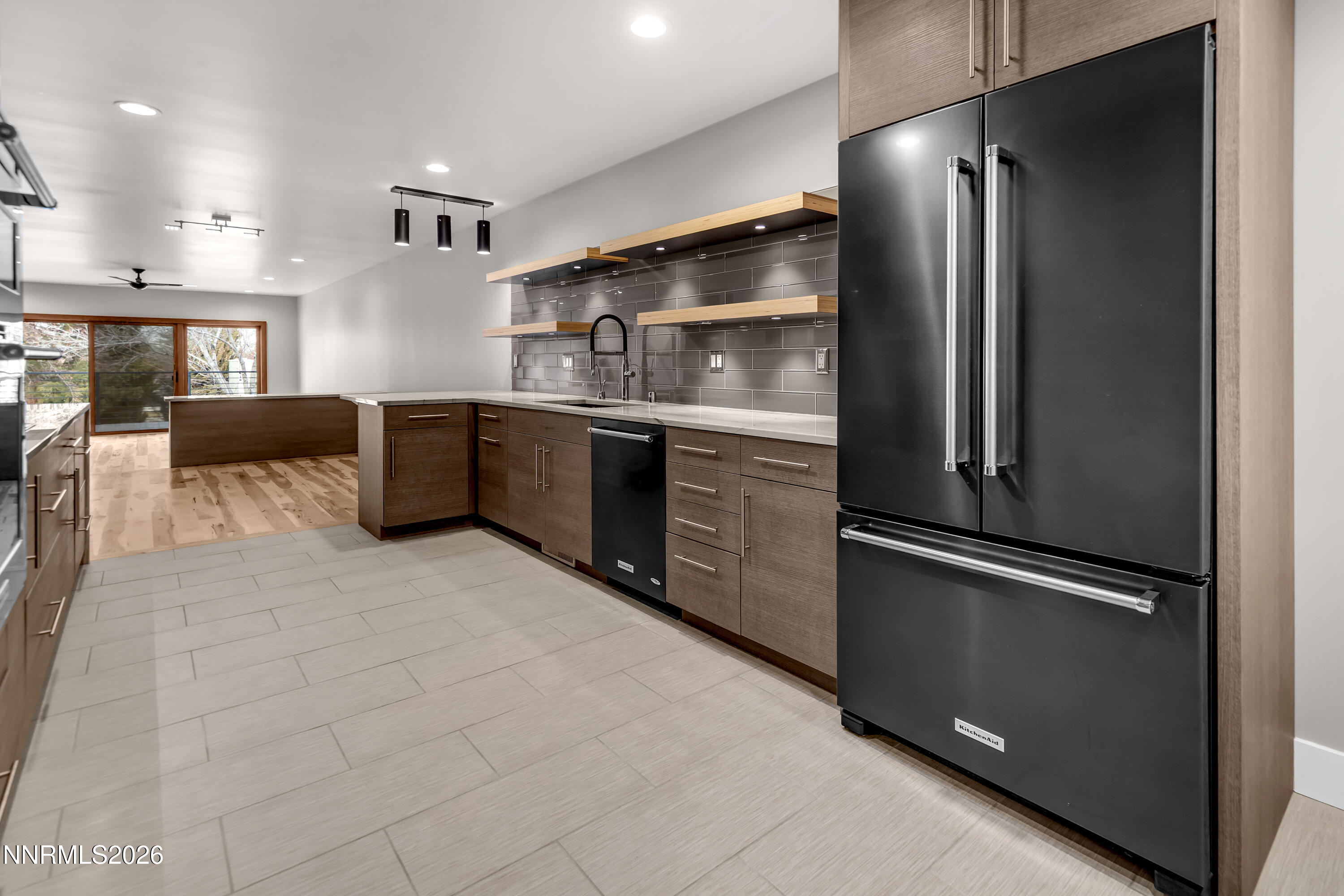 4957 Lakeridge Terrace West Reno, NV 89509 - Photo 8 of 44 a kitchen with stainless steel appliances granite countertop a refrigerator and a stove