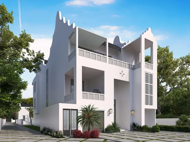 a front view of a house with plants