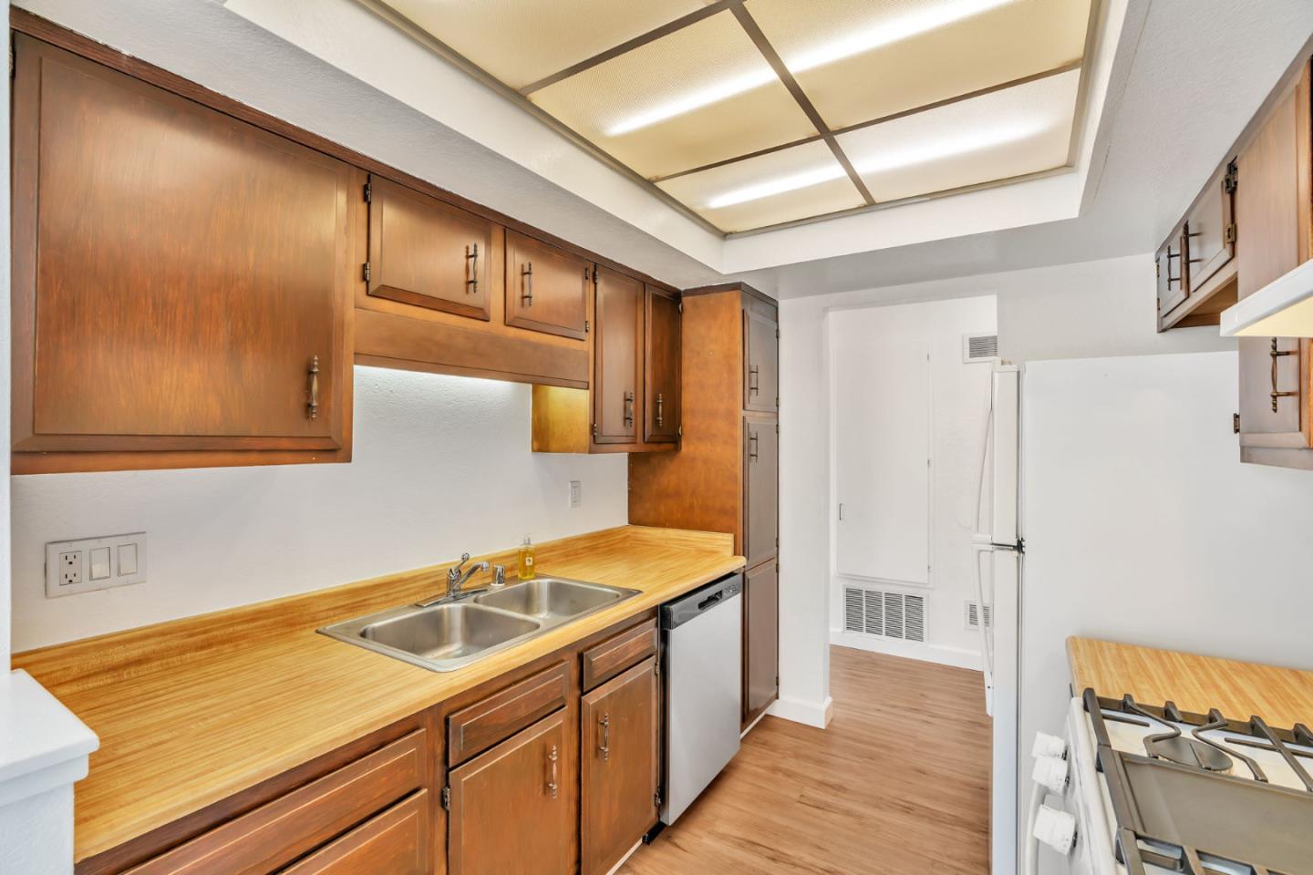 2416 North Main Street, Unit F Salinas, CA 93906 - Photo 12 of 39 a kitchen with a sink and refrigerator