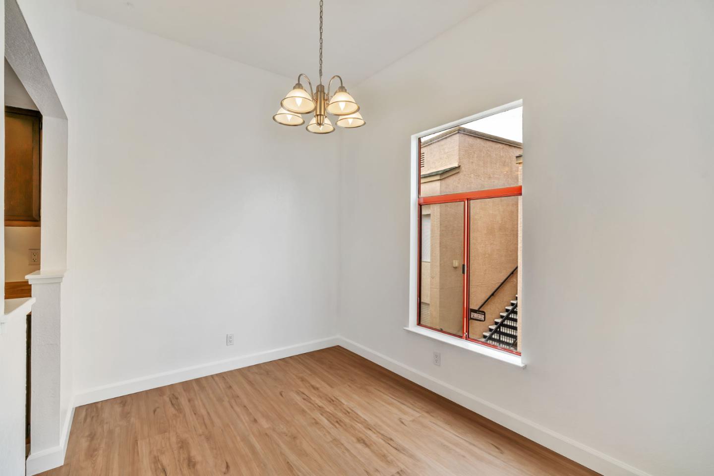 2416 North Main Street, Unit F Salinas, CA 93906 - Photo 14 of 39 an empty room with windows and chandelier