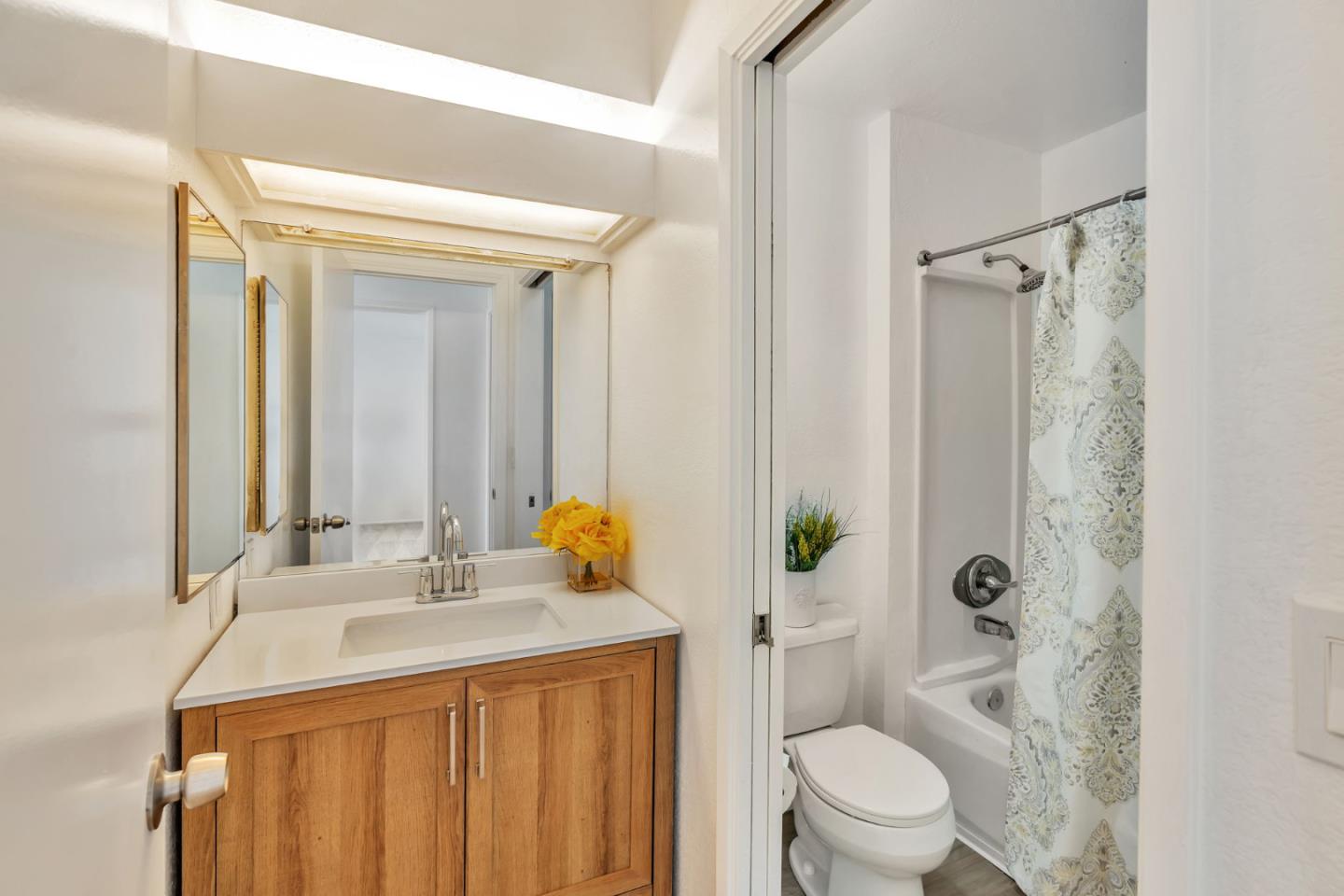 2416 North Main Street, Unit F Salinas, CA 93906 - Photo 15 of 39 a bathroom with a sink a toilet and shower
