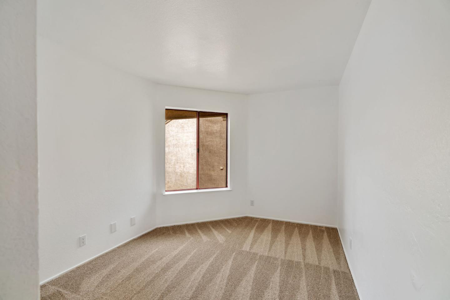 2416 North Main Street, Unit F Salinas, CA 93906 - Photo 19 of 39 an empty room with a window
