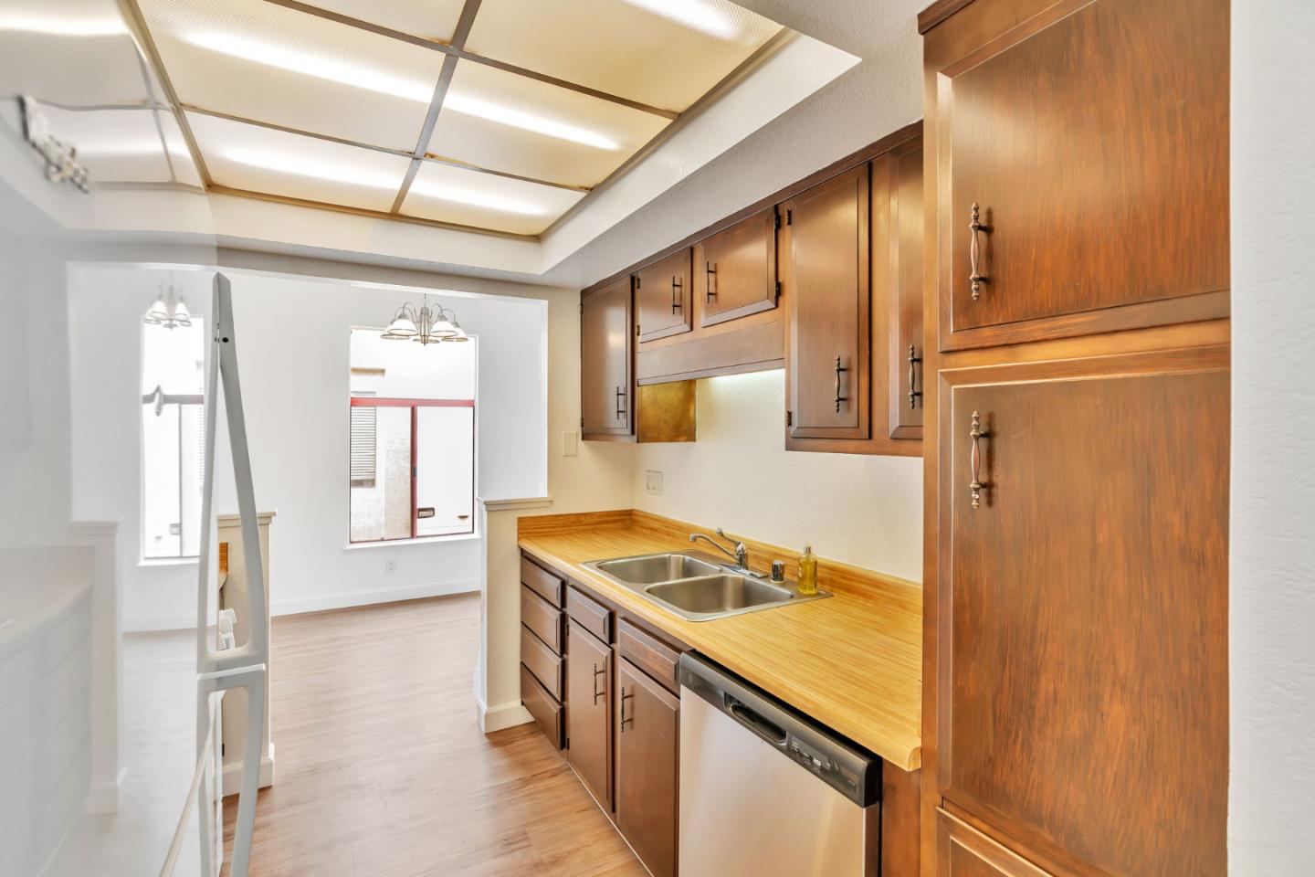 2416 North Main Street, Unit F Salinas, CA 93906 - Photo 8 of 39 a kitchen with stainless steel appliances granite countertop cabinets and a stove