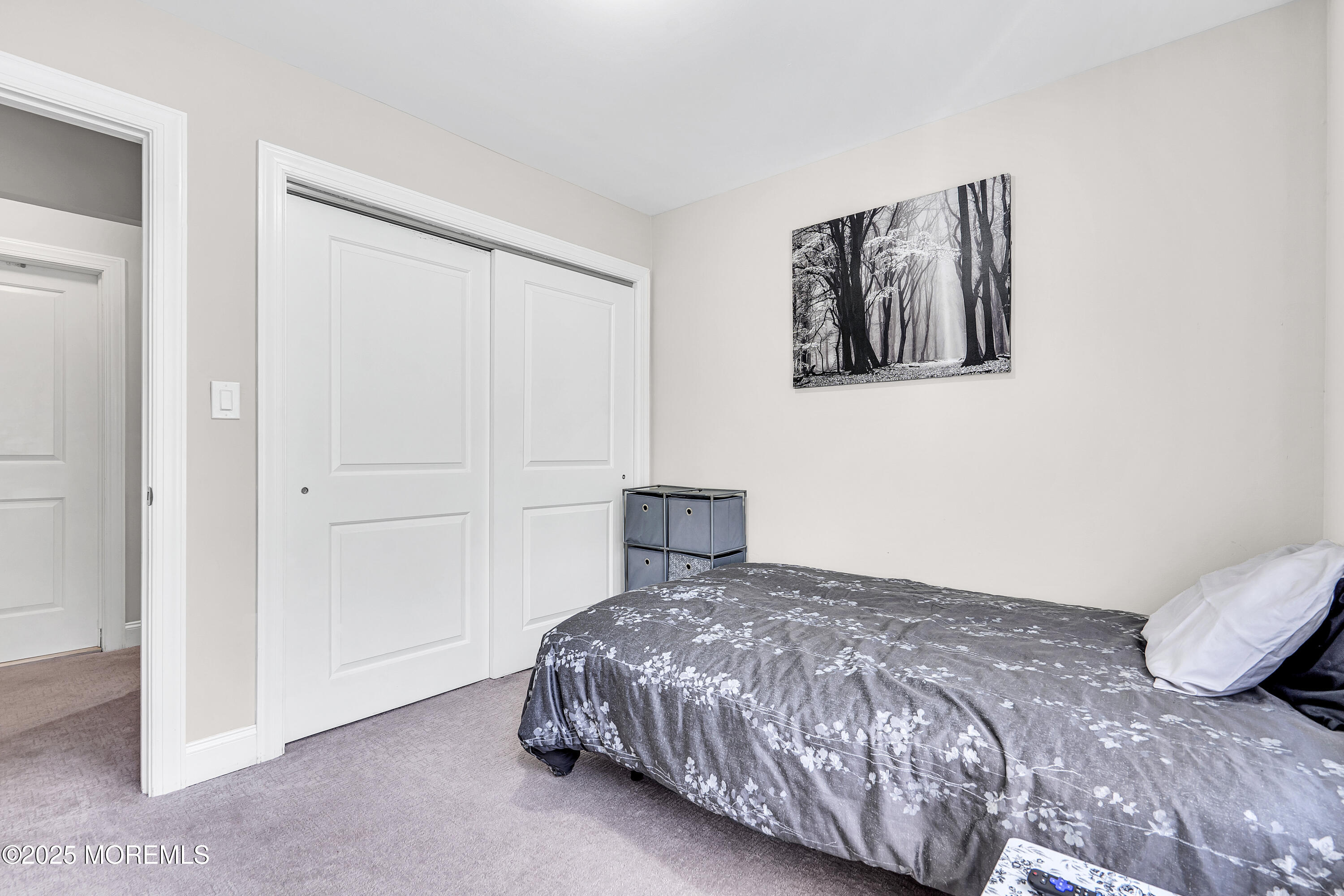 39 Colonial Court Jackson, NJ 08527 - Photo 14 of 26 a bedroom with a bed and a painting on the wall