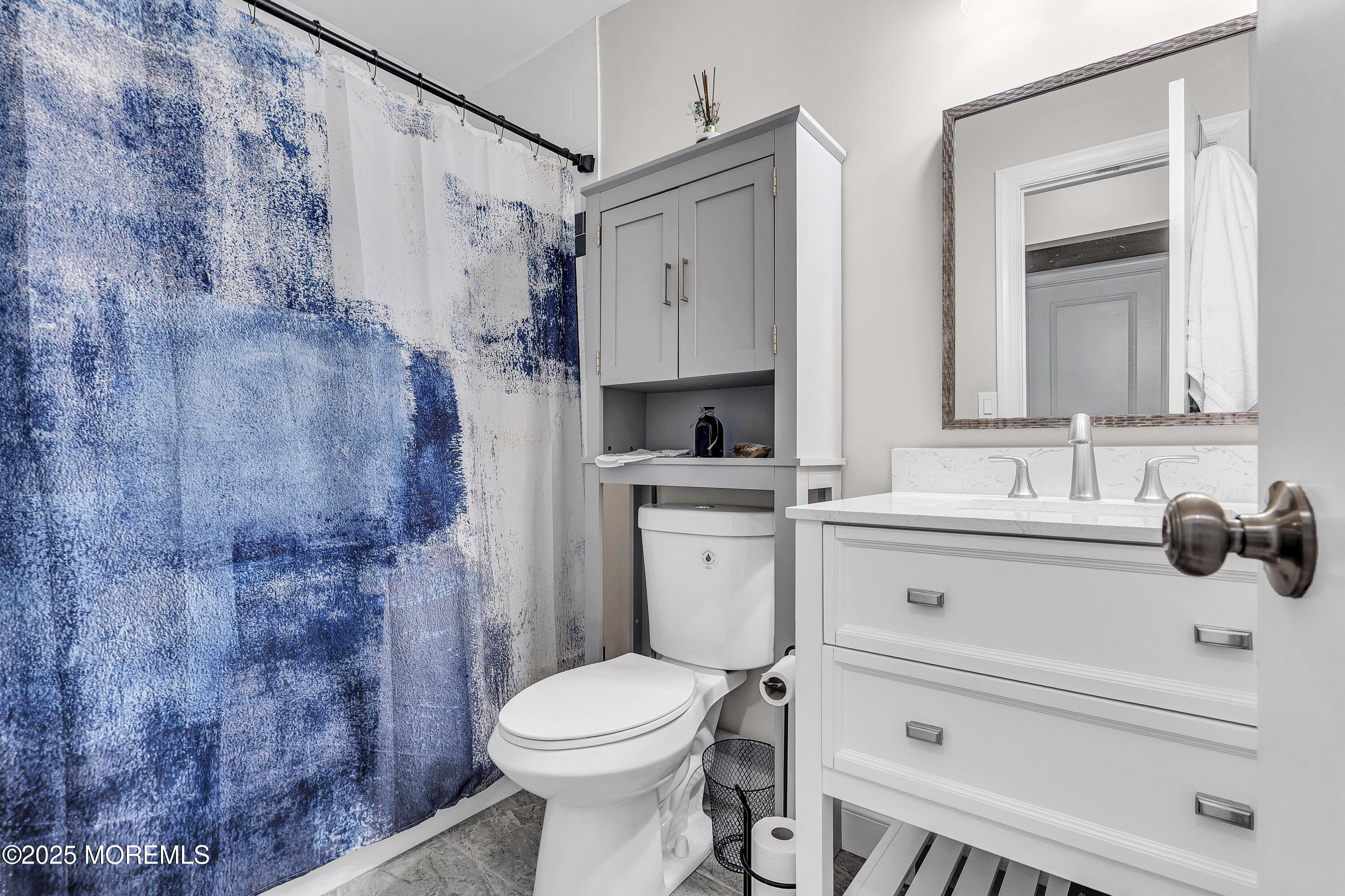39 Colonial Court Jackson, NJ 08527 - Photo 16 of 26 a bathroom with a sink a toilet and shower