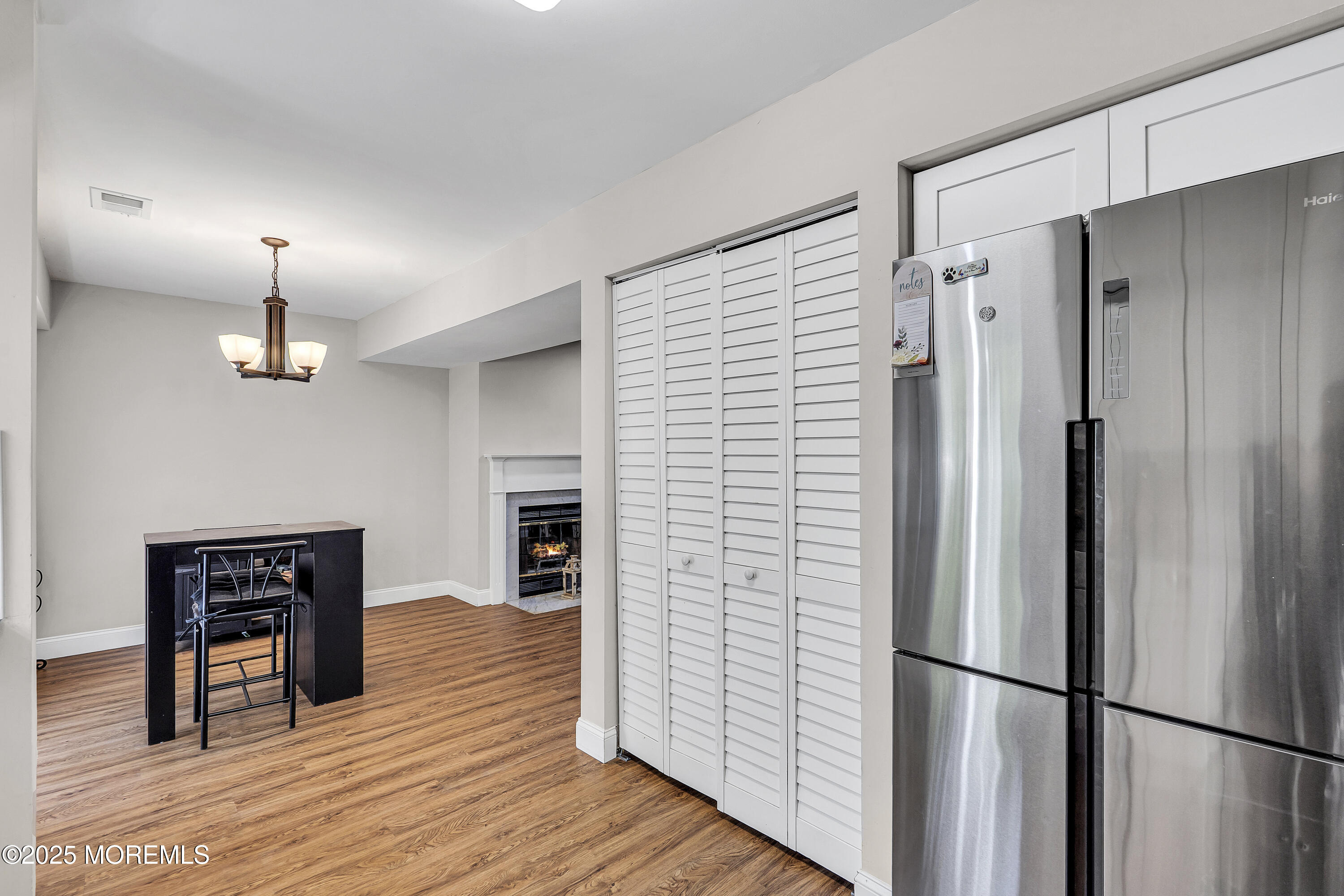 39 Colonial Court Jackson, NJ 08527 - Photo 21 of 26 a kitchen with stainless steel appliances refrigerator and wooden floor