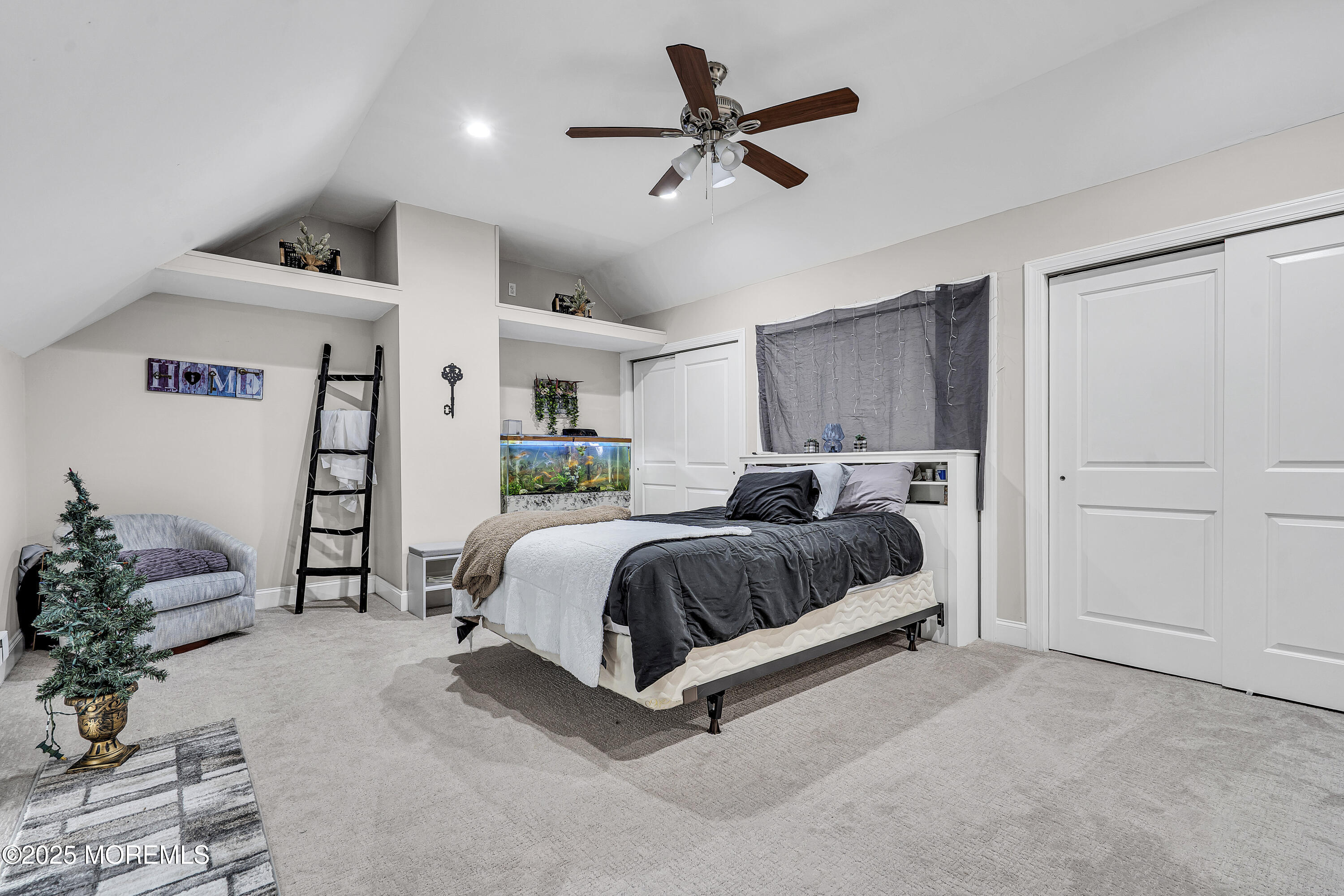 39 Colonial Court Jackson, NJ 08527 - Photo 26 of 26 a spacious bedroom with a bed and a potted plant