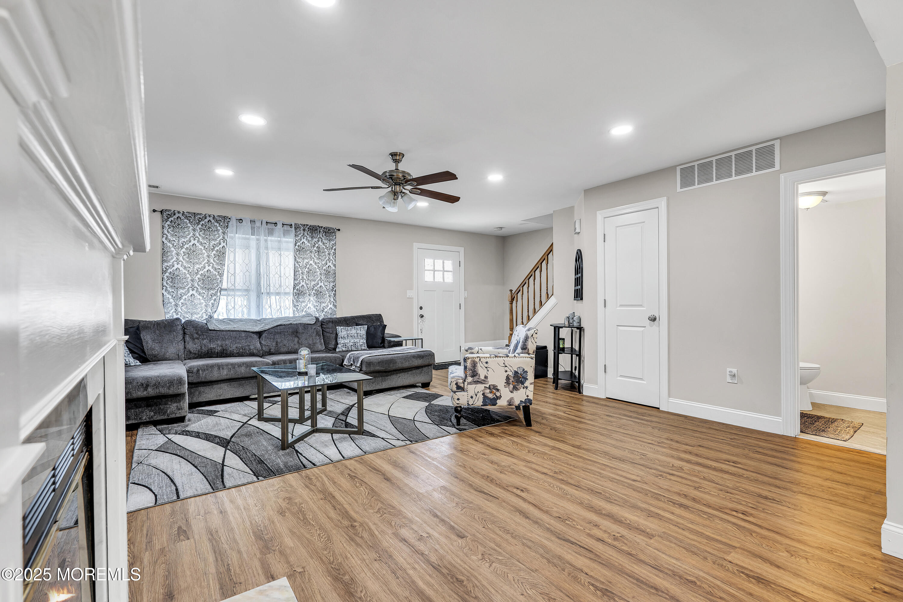 39 Colonial Court Jackson, NJ 08527 - Photo 7 of 26 a living room with furniture and wooden floor