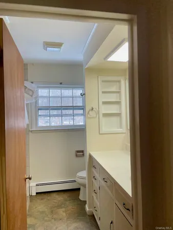 a view of an empty room and a window
