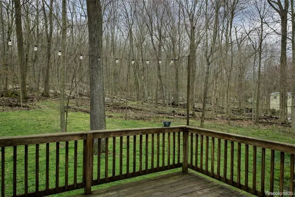 a balcony with trees in front of it