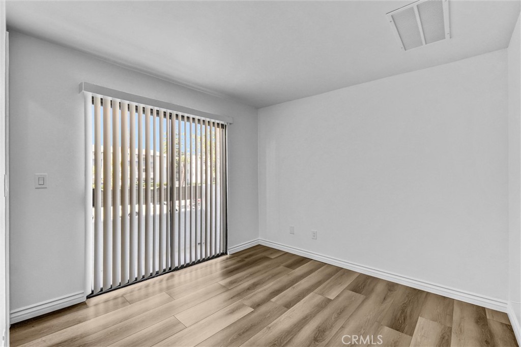 19620 Sherman Way, Unit 1 Reseda, CA 91335 - Photo 15 of 29 a view of a livingroom with wooden floor