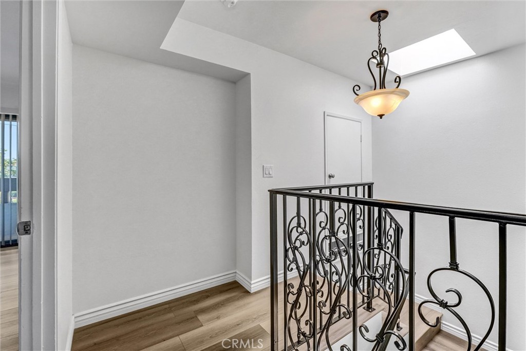 19620 Sherman Way, Unit 1 Reseda, CA 91335 - Photo 19 of 29 a view of a balcony with wooden floor