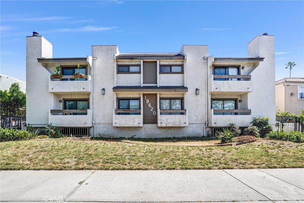 19620 Sherman Way, Unit 1 Reseda, CA 91335 - Photo 2 of 29 a front view of a house with garden
