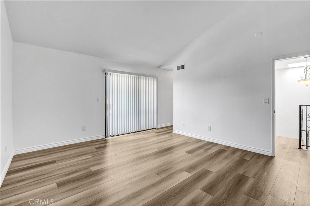 19620 Sherman Way, Unit 1 Reseda, CA 91335 - Photo 24 of 29 a view of an empty room with wooden floor