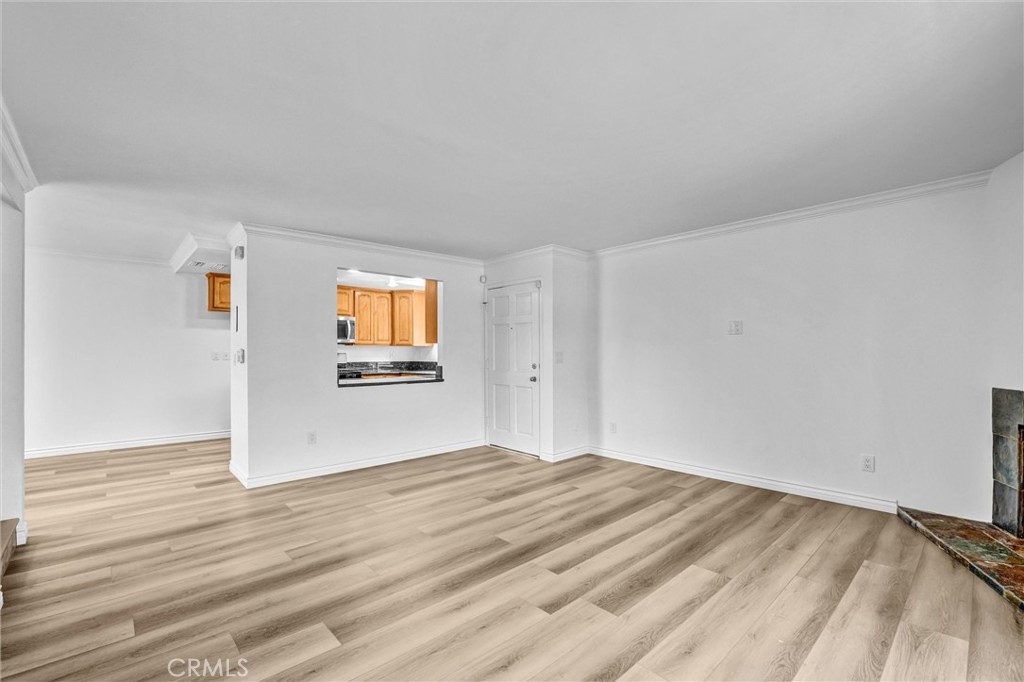19620 Sherman Way, Unit 1 Reseda, CA 91335 - Photo 7 of 29 a view of a livingroom with wooden floor and windows