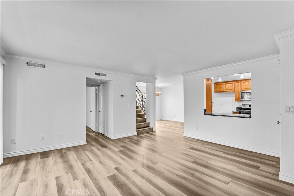 19620 Sherman Way, Unit 1 Reseda, CA 91335 - Photo 8 of 29 a view of empty room with wooden floor