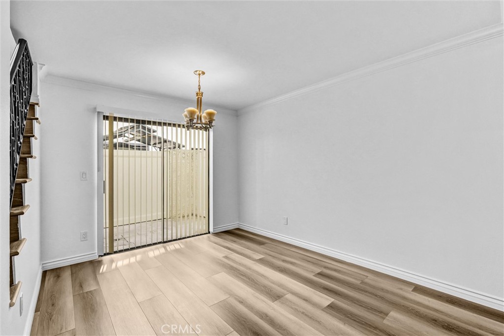 19620 Sherman Way, Unit 1 Reseda, CA 91335 - Photo 9 of 29 wooden floor in an empty room with a window